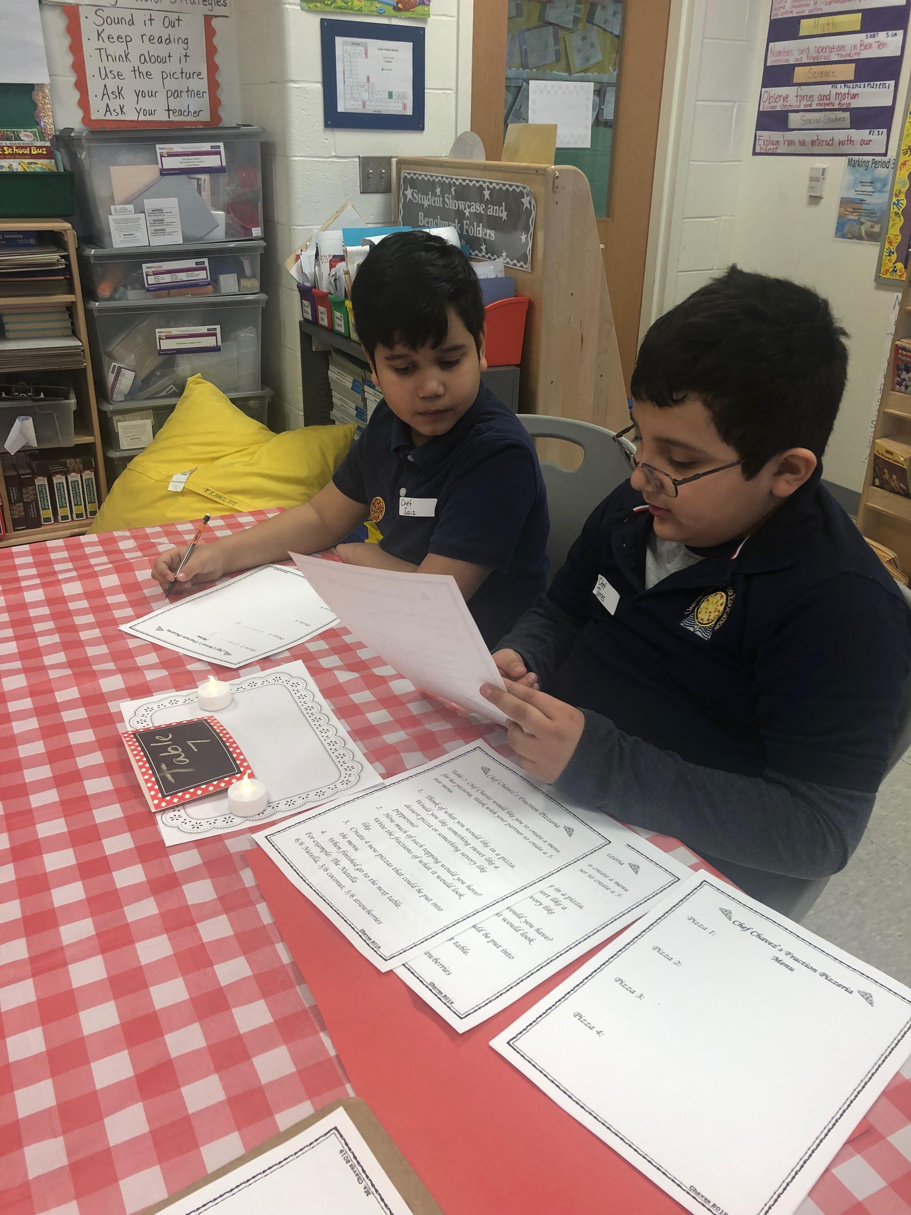 two boys working on fractions together