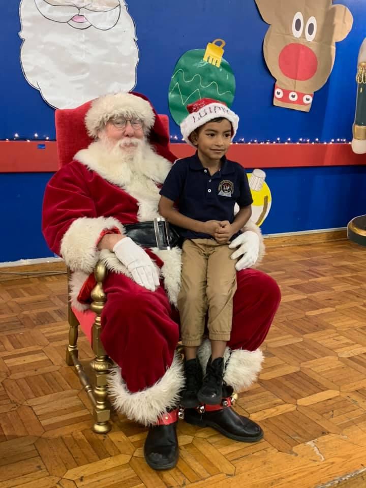 santa with little boy sitting on his lap